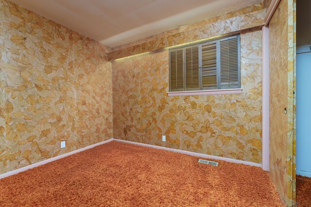 1930 Whittlesey St, Flint, MI 48503 - carpeted empty room featuring baseboards, visible vents, and wallpapered walls