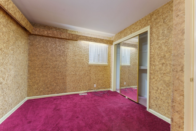 1930 Whittlesey St, Flint, MI 48503 - empty room featuring wallpapered walls, carpet floors, baseboards, and visible vents