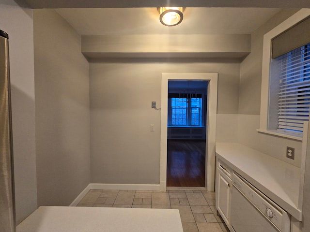 interior space featuring light hardwood / wood-style flooring and white cabinets