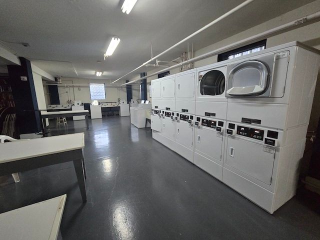 laundry area featuring washer and clothes dryer and stacked washer and clothes dryer