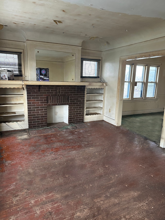 unfurnished living room with a fireplace and hardwood / wood-style flooring