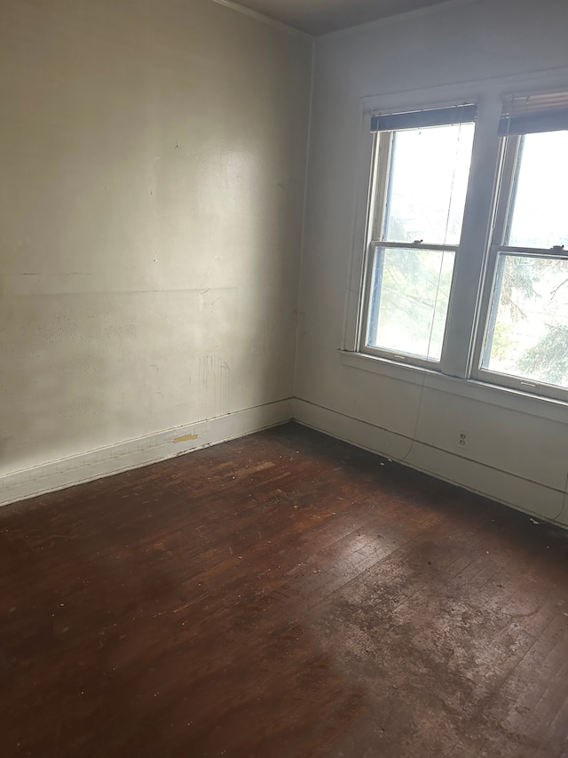 empty room featuring dark wood-type flooring