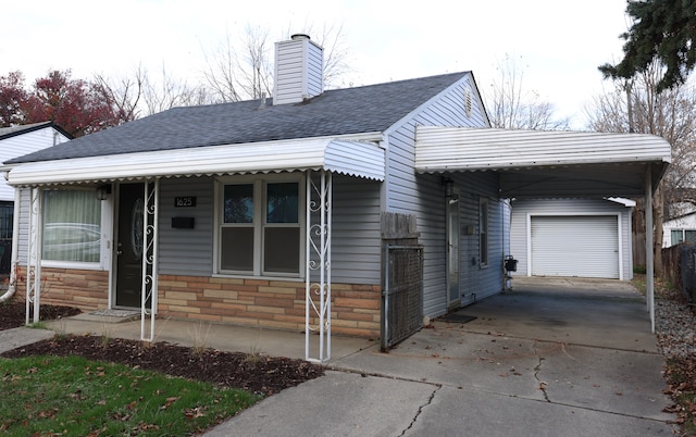 view of front facade featuring a carport and a garage