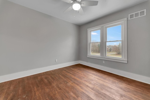 empty room featuring ceiling fan and wood-type flooring