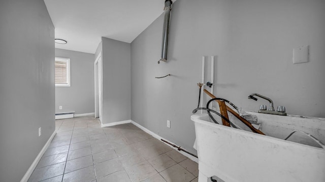 washroom featuring light tile patterned floors and a baseboard heating unit