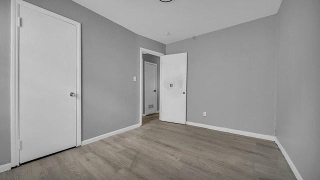 unfurnished bedroom with light hardwood / wood-style flooring