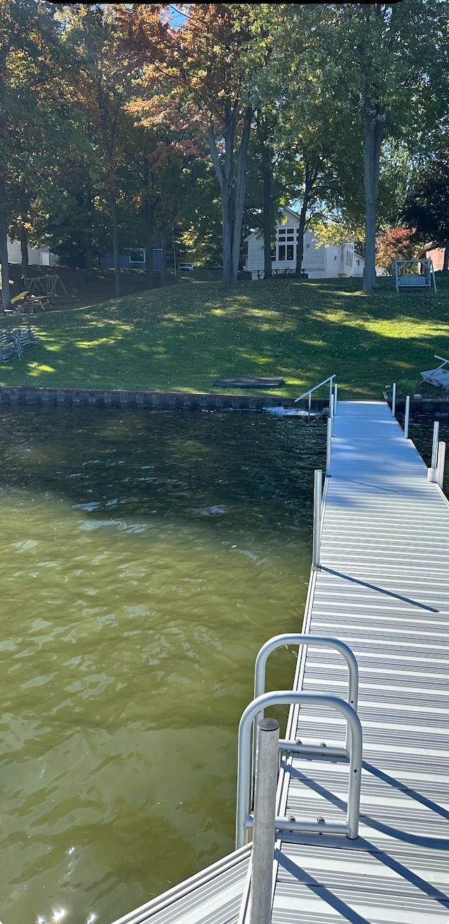 view of dock with a water view