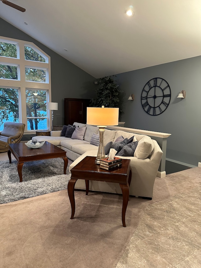 living room featuring light carpet and lofted ceiling