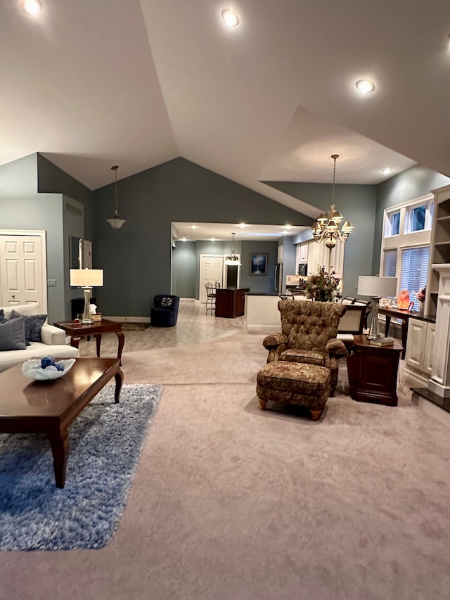 carpeted living room with a chandelier and lofted ceiling