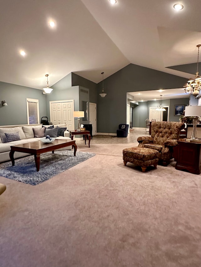 carpeted living room with lofted ceiling and an inviting chandelier