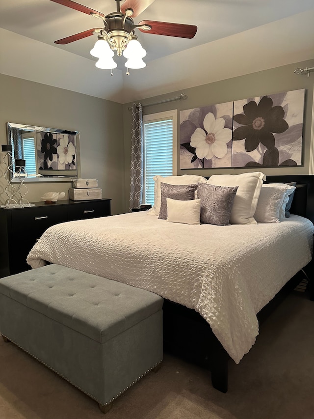 bedroom featuring ceiling fan and carpet floors