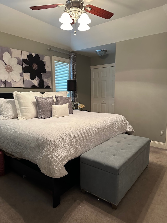 bedroom with ceiling fan, a closet, and carpet