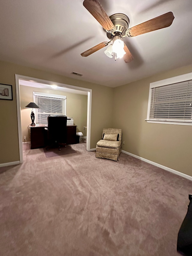 unfurnished office with carpet flooring and ceiling fan