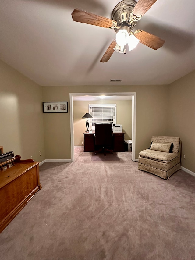 office space featuring ceiling fan and carpet