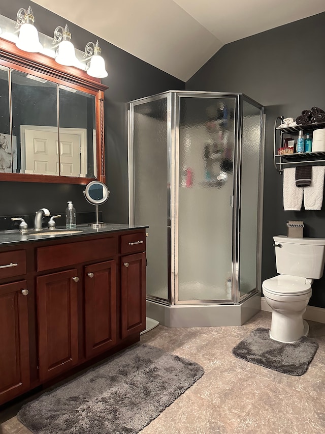 bathroom with toilet, vanity, lofted ceiling, and walk in shower