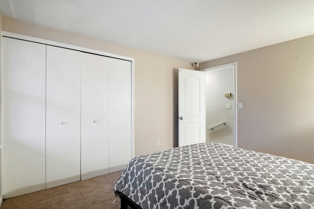 carpeted bedroom featuring a closet