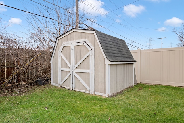 view of outdoor structure with a lawn