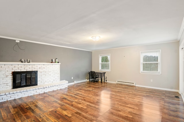 unfurnished living room featuring a fireplace, hardwood / wood-style floors, crown molding, and a baseboard heating unit