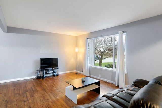 living room with light hardwood / wood-style floors