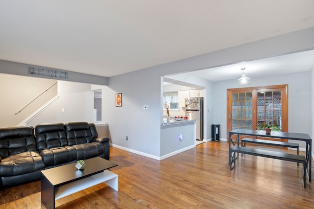 living room with light wood-type flooring and a wealth of natural light