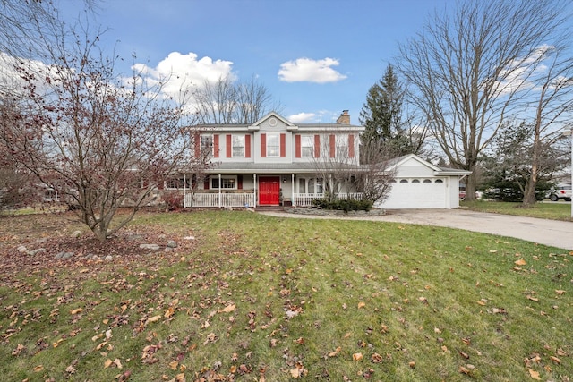 view of front of house featuring a porch, a garage, and a front lawn