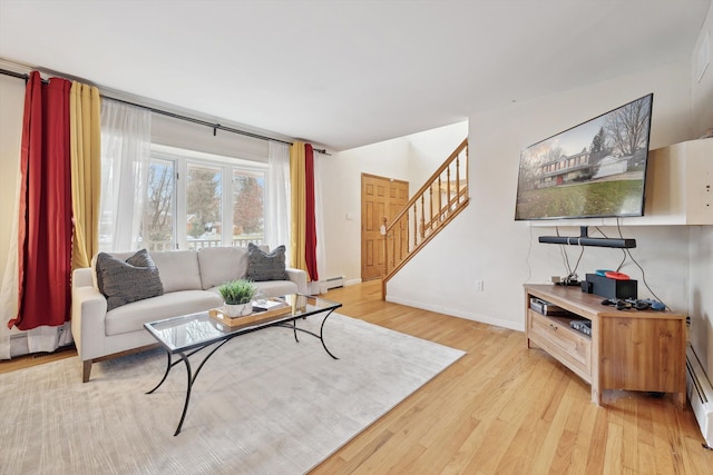 living room featuring light hardwood / wood-style floors and a baseboard radiator