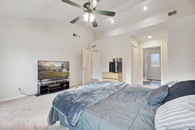 carpeted bedroom featuring ceiling fan and high vaulted ceiling