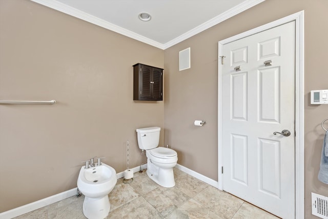 bathroom featuring toilet, crown molding, and a bidet