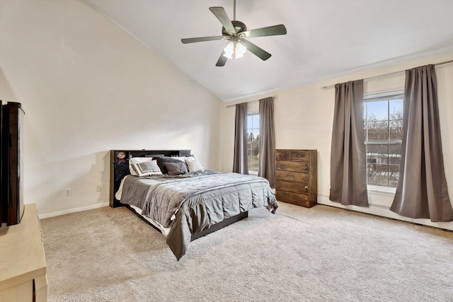 bedroom with light carpet, high vaulted ceiling, and ceiling fan