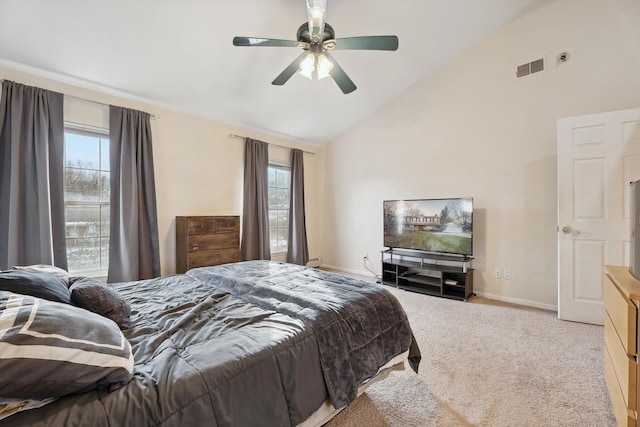 carpeted bedroom with vaulted ceiling and ceiling fan