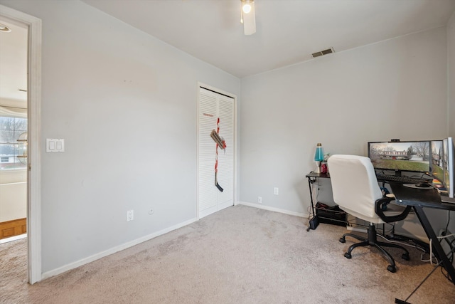 office featuring ceiling fan and light carpet