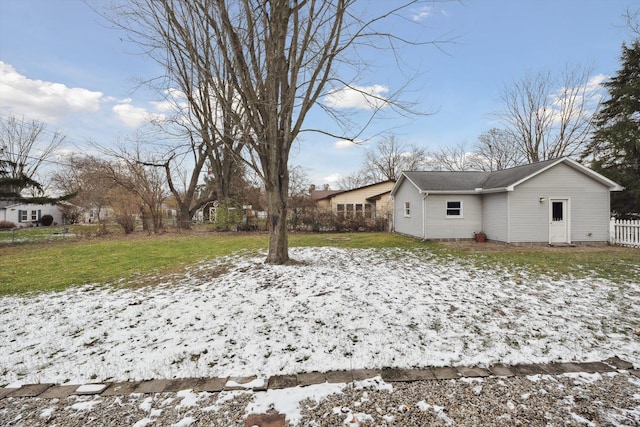 view of yard layered in snow