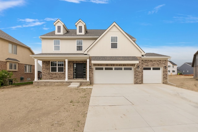 view of front of home with a porch and a garage