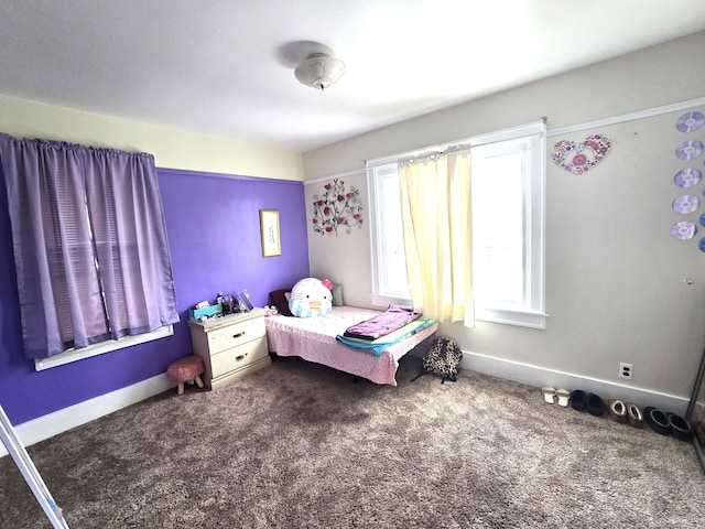 bedroom with dark carpet