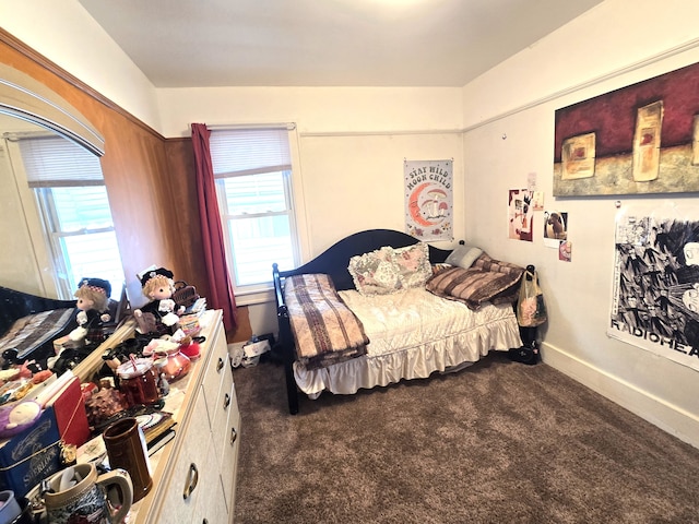 bedroom featuring dark colored carpet