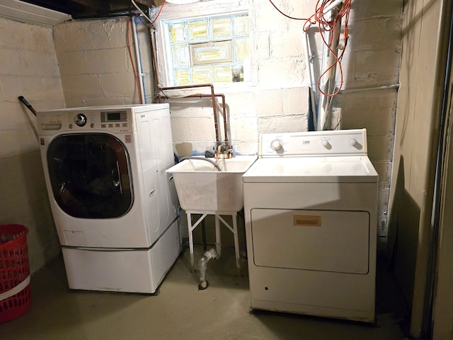 clothes washing area featuring independent washer and dryer