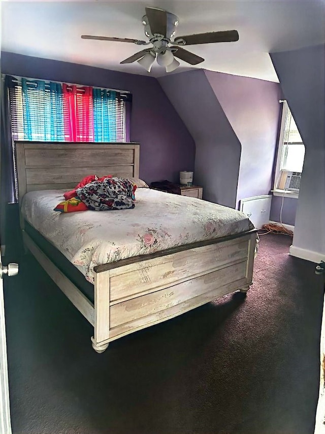 bedroom featuring ceiling fan, cooling unit, vaulted ceiling, and dark colored carpet