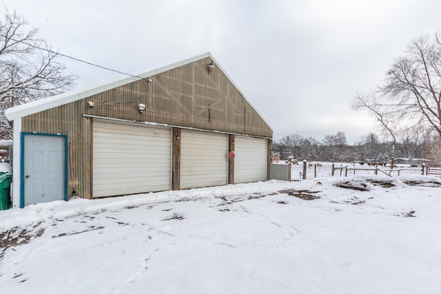 view of snow covered garage