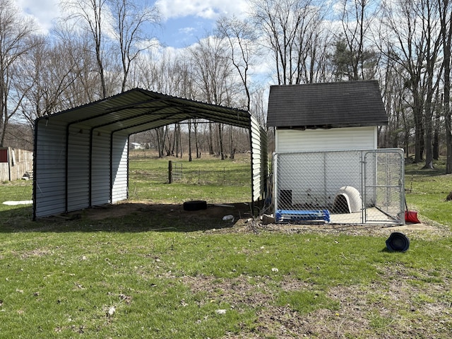 exterior space with a detached carport and an outbuilding