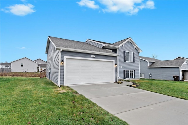 view of front of home with a front yard and a garage