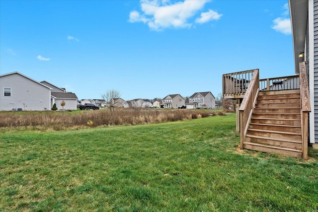 view of yard featuring a wooden deck