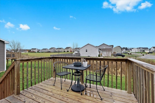 wooden deck featuring a yard