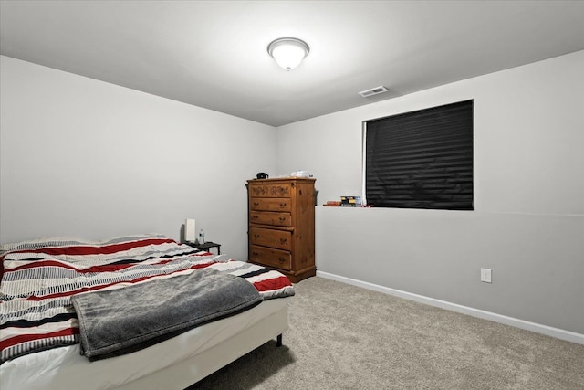 bedroom with light carpet