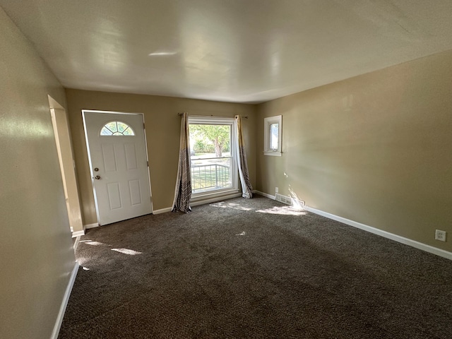 view of carpeted foyer