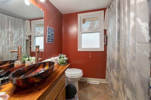 bathroom with vanity and toilet