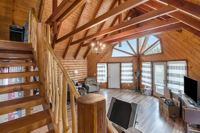 living room with wood-type flooring, high vaulted ceiling, wooden walls, and beam ceiling