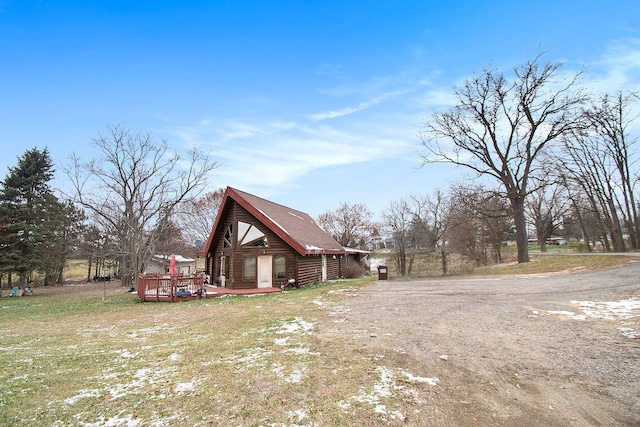 view of property exterior featuring a deck