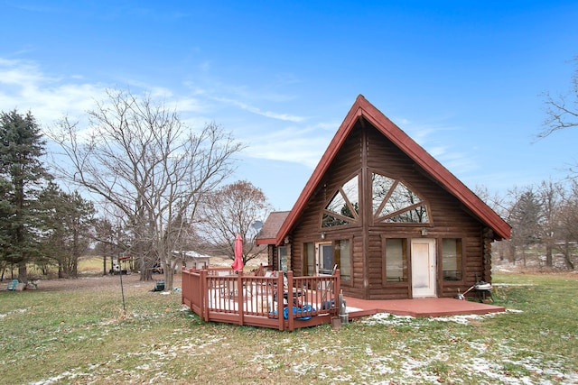 back of property with a lawn