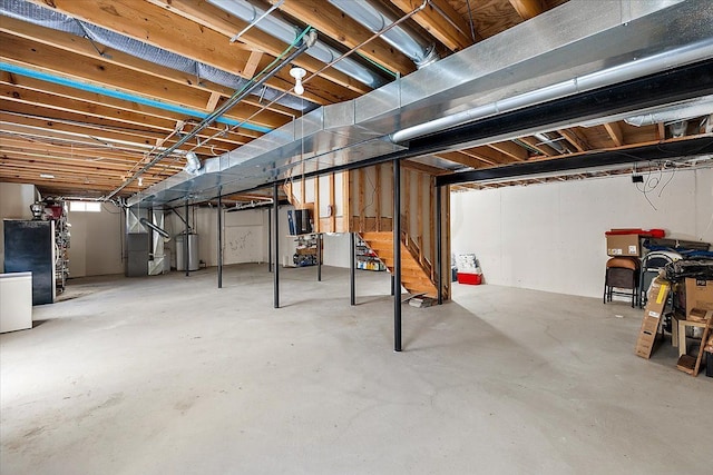 basement with heating unit and water heater