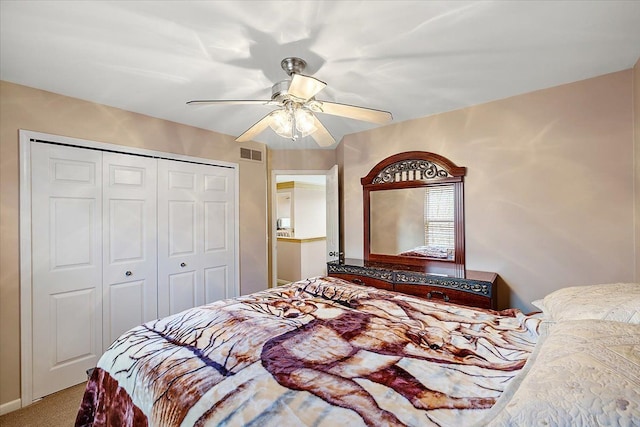 bedroom featuring carpet flooring, ceiling fan, and a closet